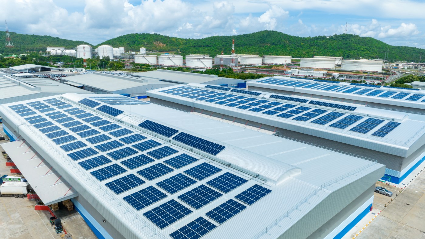 top-view-solar-cell-warehouse-factory-solor-photo-voltaic-panels-system-power-solar-cell-industrial-building-roof-producing-green-ecological-electricity-production-renewable-energy (Custom)